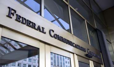 The sign over the door at the entrance to the FCC headquarters