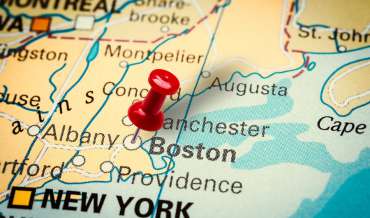 A map of Massachusetts with a red pushpin in Boston