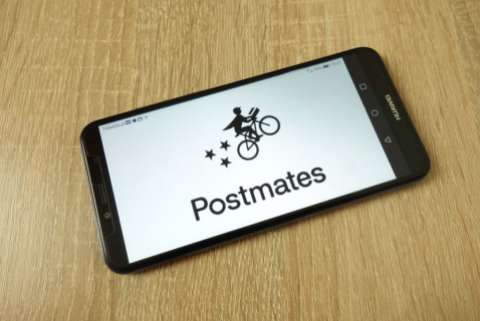 A smartphone displaying the Postmates logo