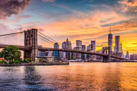 The Brooklyn Bridge and Manhattan skyline at sunset