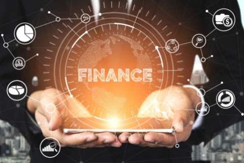 hands holding a cell phone with abstract icons and the word finance overlaid