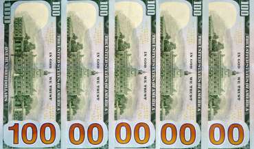 Hundred dollar bills arranged such that they show "10,000,000"