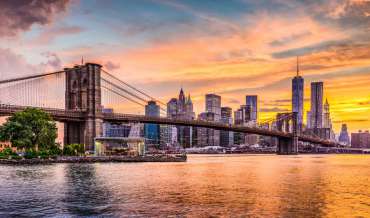 The Brooklyn Bridge and Manhattan skyline at sunset