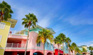 The colorful facades of buildings and palm trees in Fort Myers, Florida